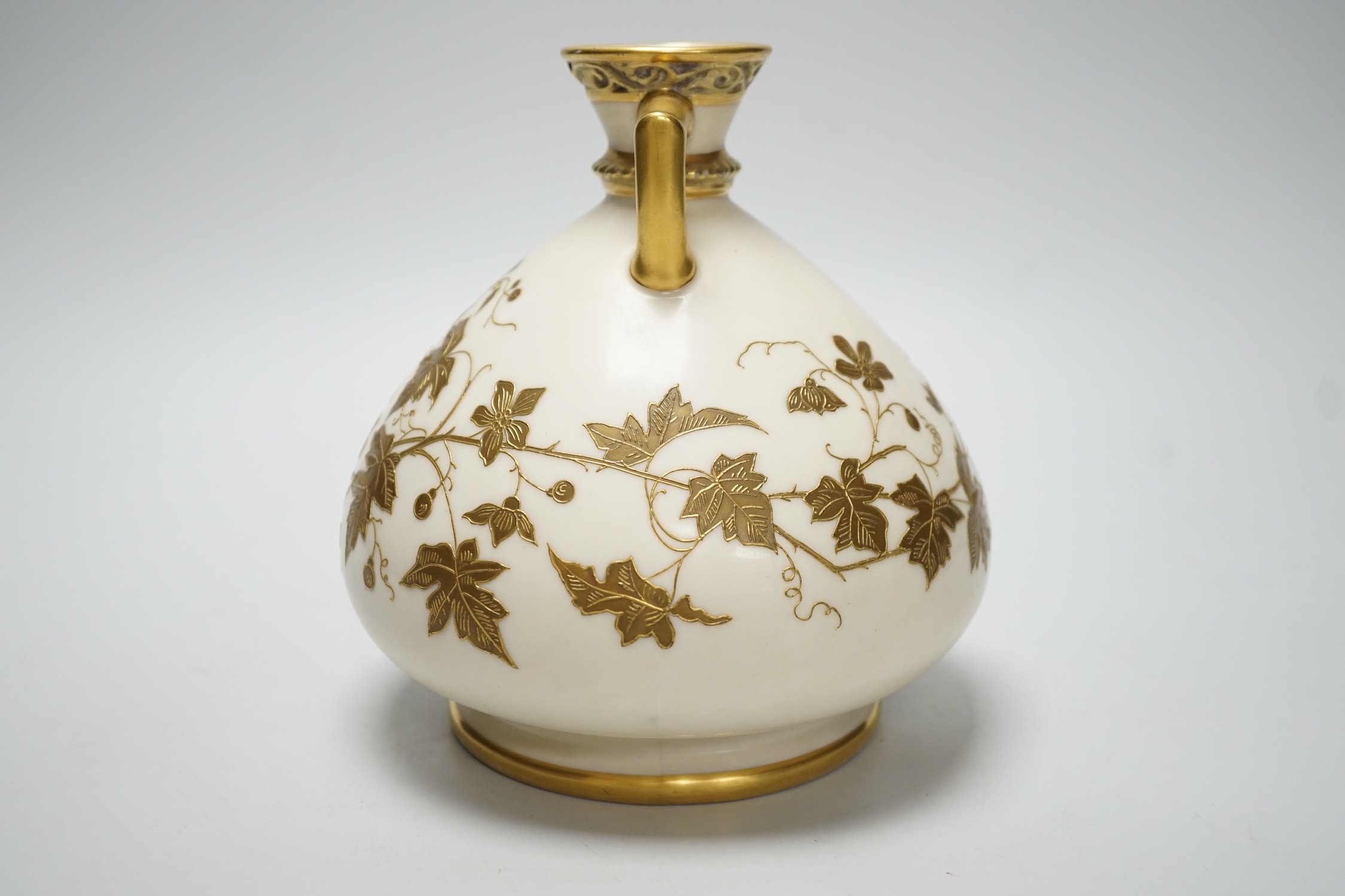 A Royal Worcester gilded vase of bulbous form, 17cm